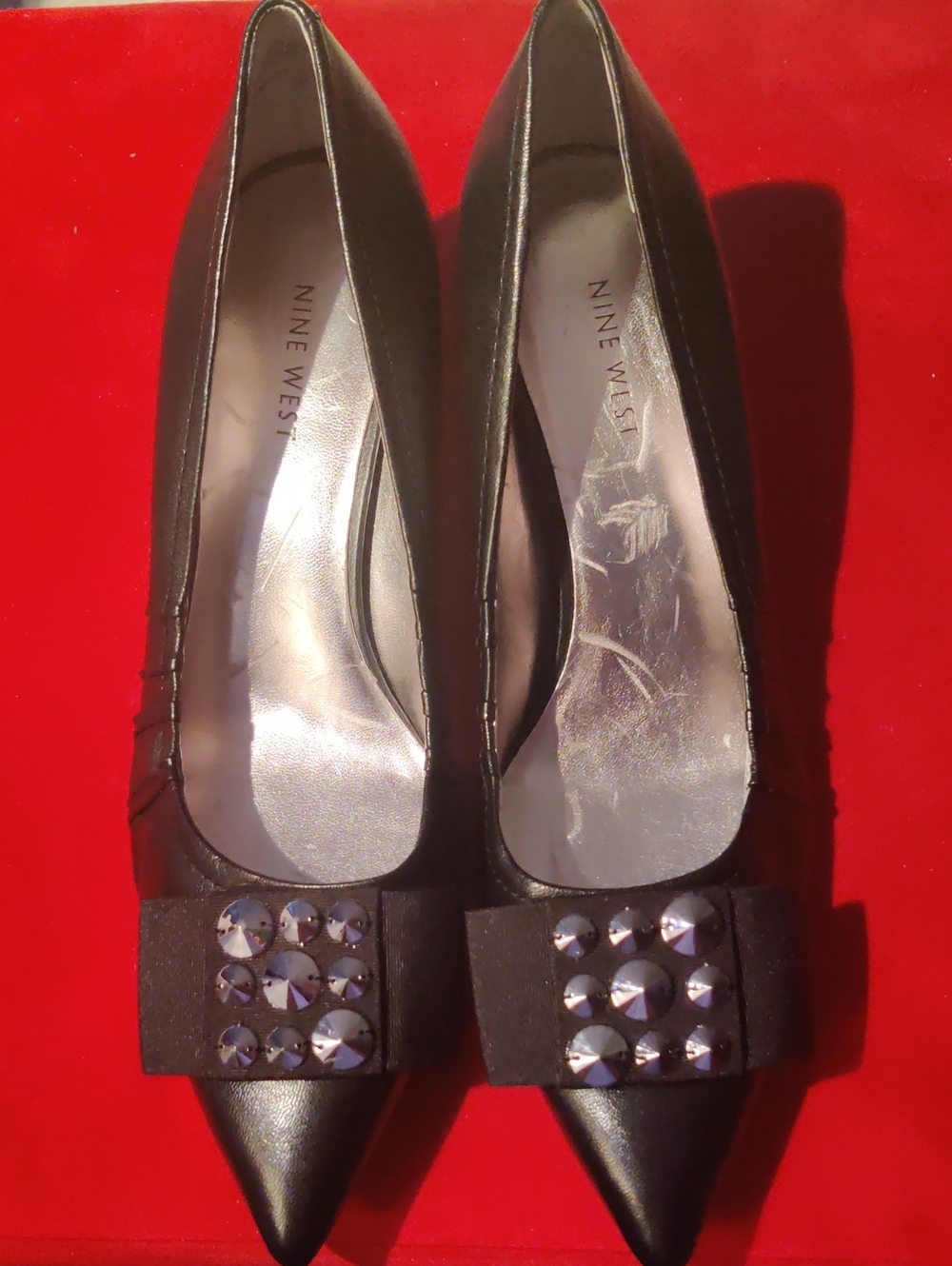 Nine West Pointed-Toe Pumps featuring a Ribbon Bow Accent with Metallic Studs...